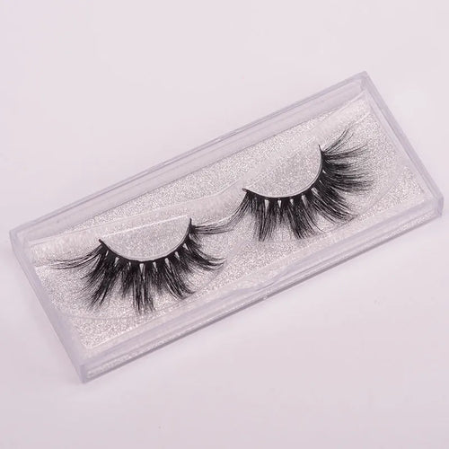 5D mink false eyelashes set with brush and storage cap on pink background