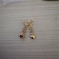 Heart-shaped women's earrings with metallic electroplated finish in gold or silver tone options