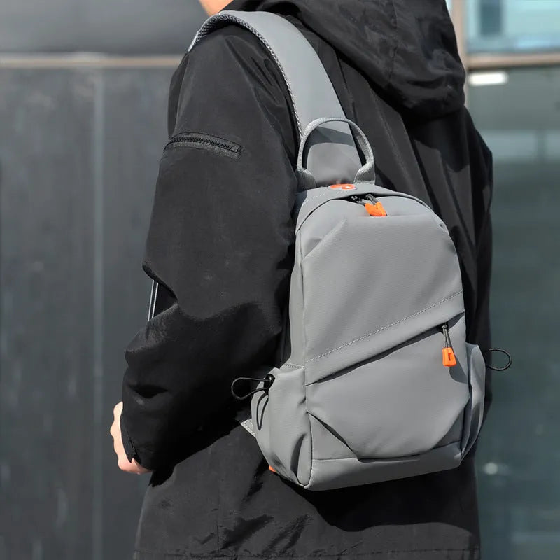 Men's black polyester crossbody bag showing single shoulder strap and simple design