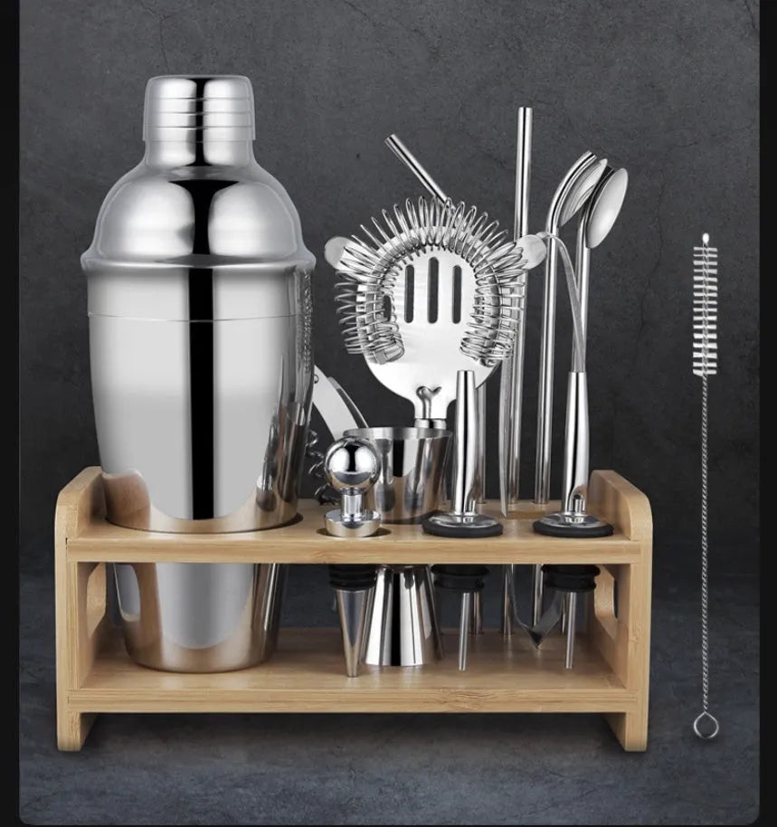 23-piece European style cocktail set with stainless steel bar tools arranged on acrylic display