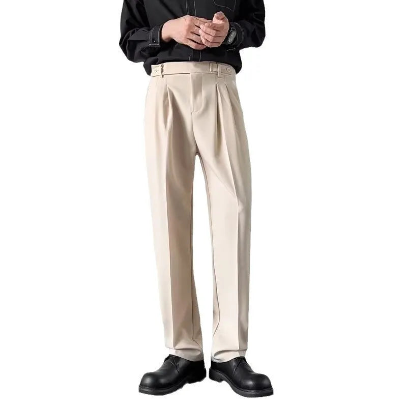 Men's straight cut loose fit suit trousers in apricot and black colours, made from polyester fabric.