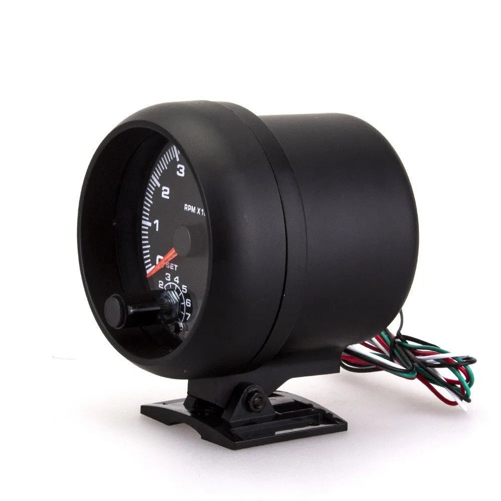 Black automotive tachometer with blue light pointer display showing RPM measurement scale