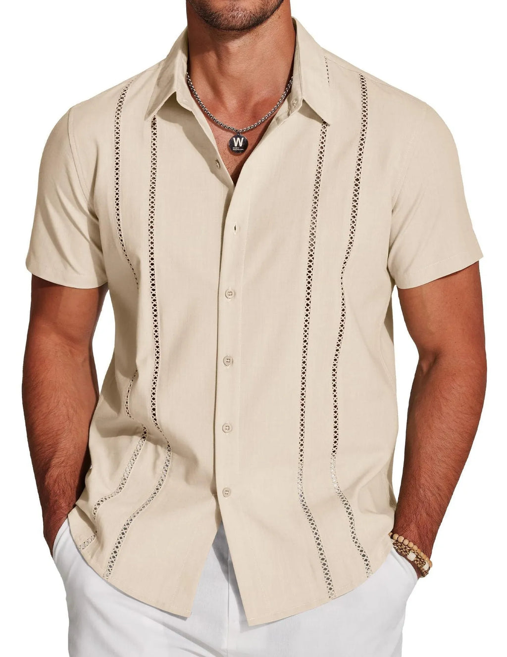 Man wearing a slim fit, short sleeve Hawaiian shirt with a colourful digital print pattern.