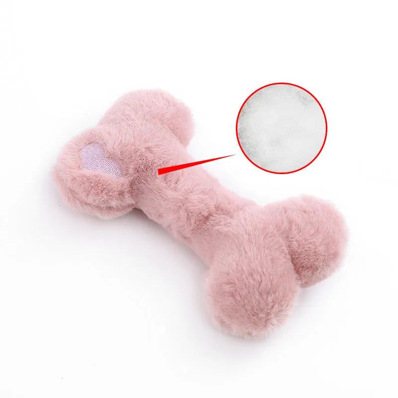Cute love bone shaped plush dog toy in blue, pink, and yellow colours for interactive chewing play.
