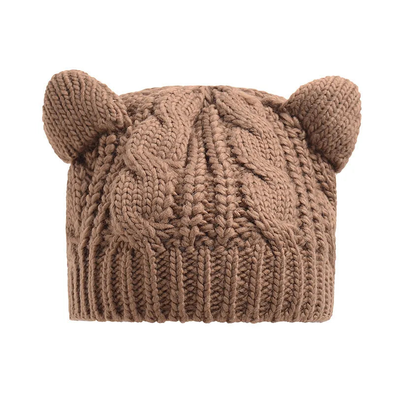 Hand-made chunky wool beanie with 3D knitted cat ears on a white background.