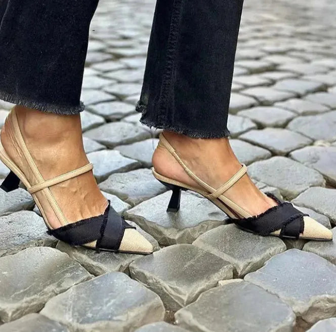 Women's apricot and black colour block stiletto sandals with pointed toe and buckle fastening.