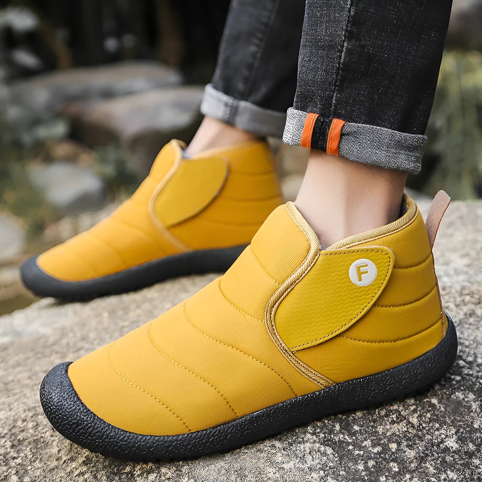 Men's waterproof snow boots in black with thick cotton upper and rubber sole.