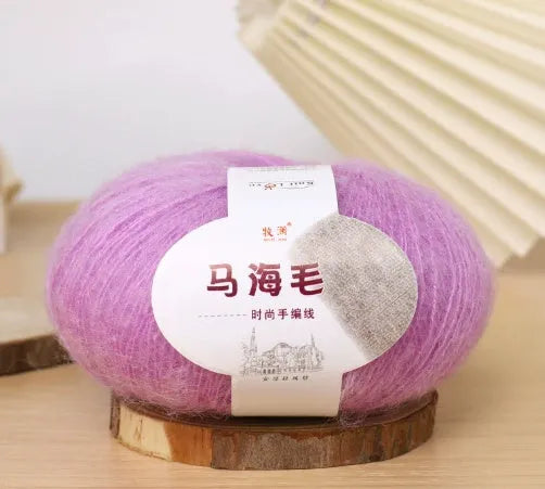 Single ball of mohair yarn in various colours for hand-woven DIY scarf knitting projects