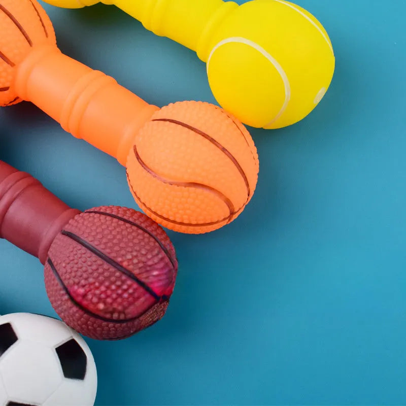 Football dumbbell shaped dog squeaky chew toy in PVC material showing brown, orange, white and yellow colour options