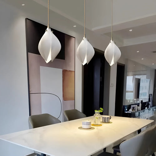 Single head ceramic magnolia flower pendant chandelier light with a minimalist design.