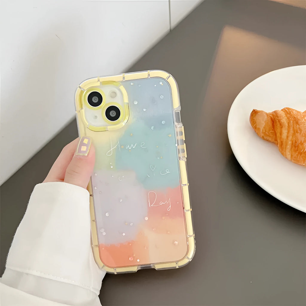 Slim minimalist silicone phone case for iPhone 14 with a yellow edge on a contrasting background.