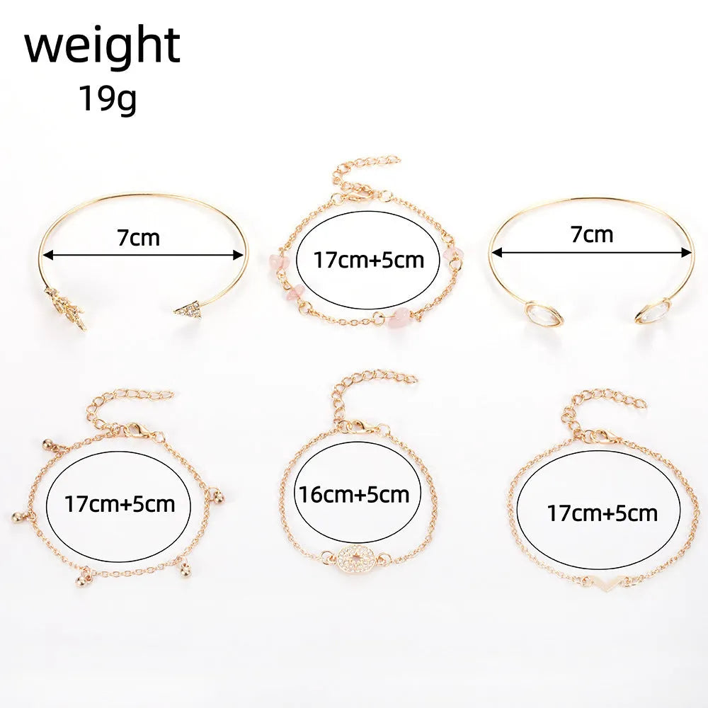 Gold-coloured six-piece women's bracelet set with arrow, water drop, and V-shaped charms on a white background.
