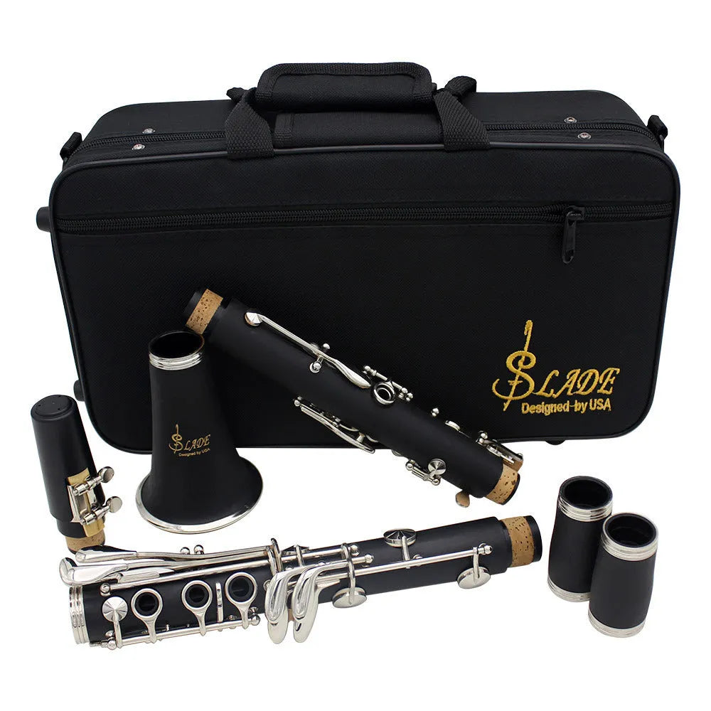 Black Bakelite clarinet with nickel keys showing 17-key mechanism and included carrying bag
