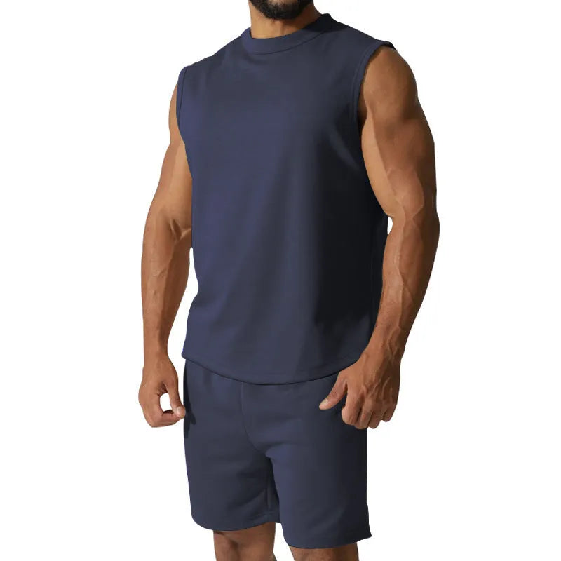 Men's sleeveless cotton blend sports top and shorts set in a solid colour.