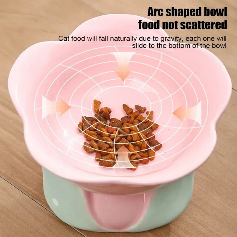 Blue ceramic elevated pet bowl with floral pattern for cats and small dogs on a non-slip base.
