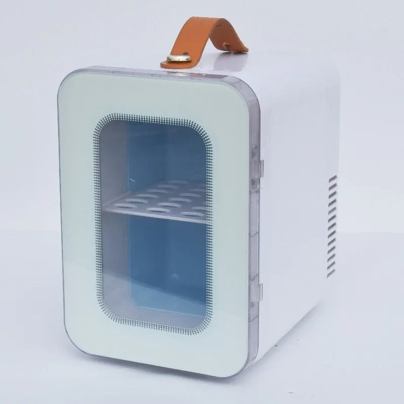 Pink mini refrigerator with transparent door showing internal storage compartments