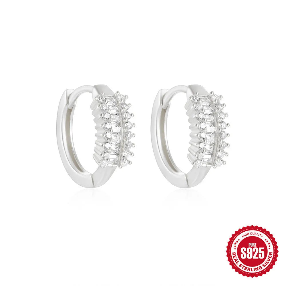 Sterling silver geometric stud earrings with small round diamond detailing in gold and silver electroplated finishes