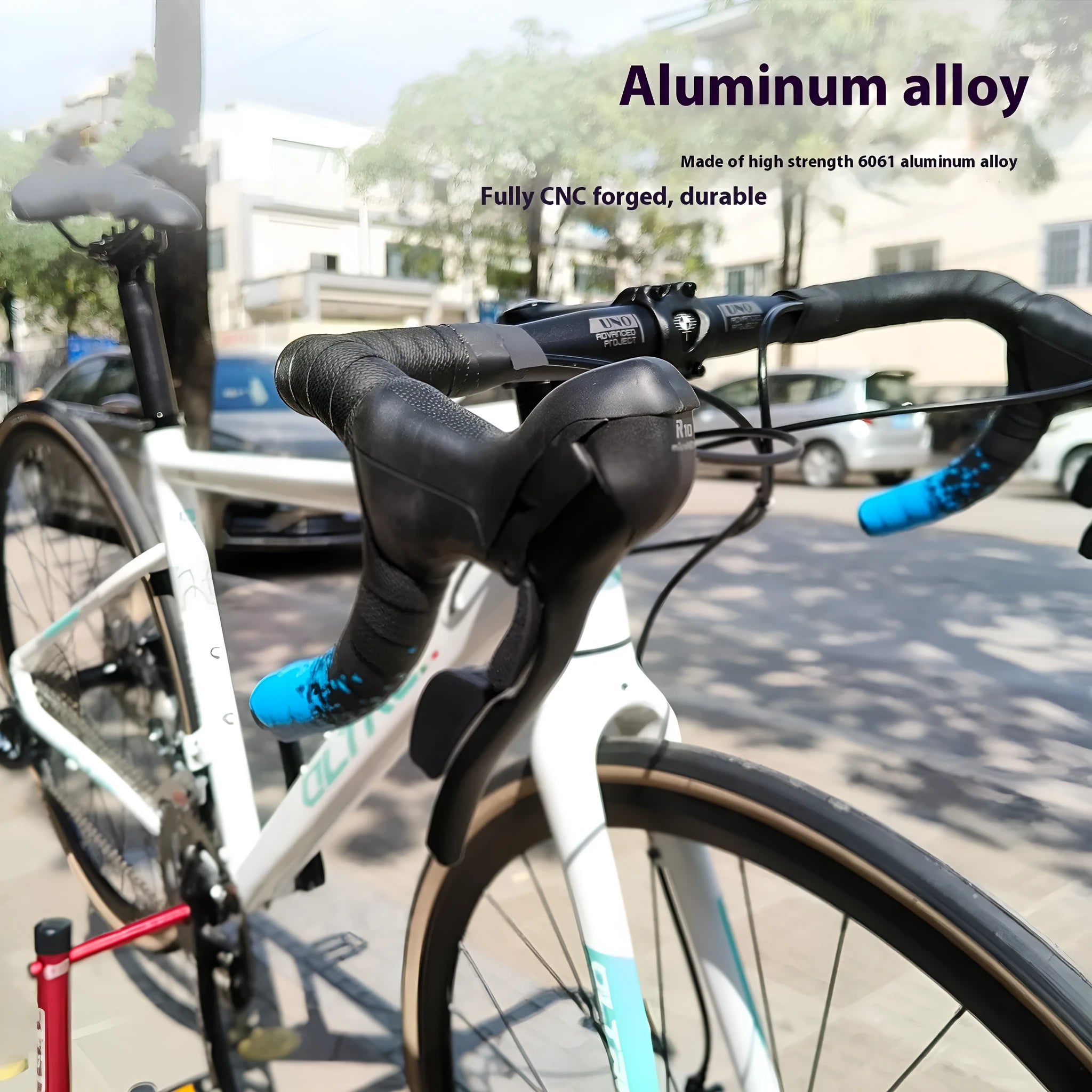 Black UNO aluminium alloy road bike drop handlebar showing curved shape and 31.8mm clamp section.