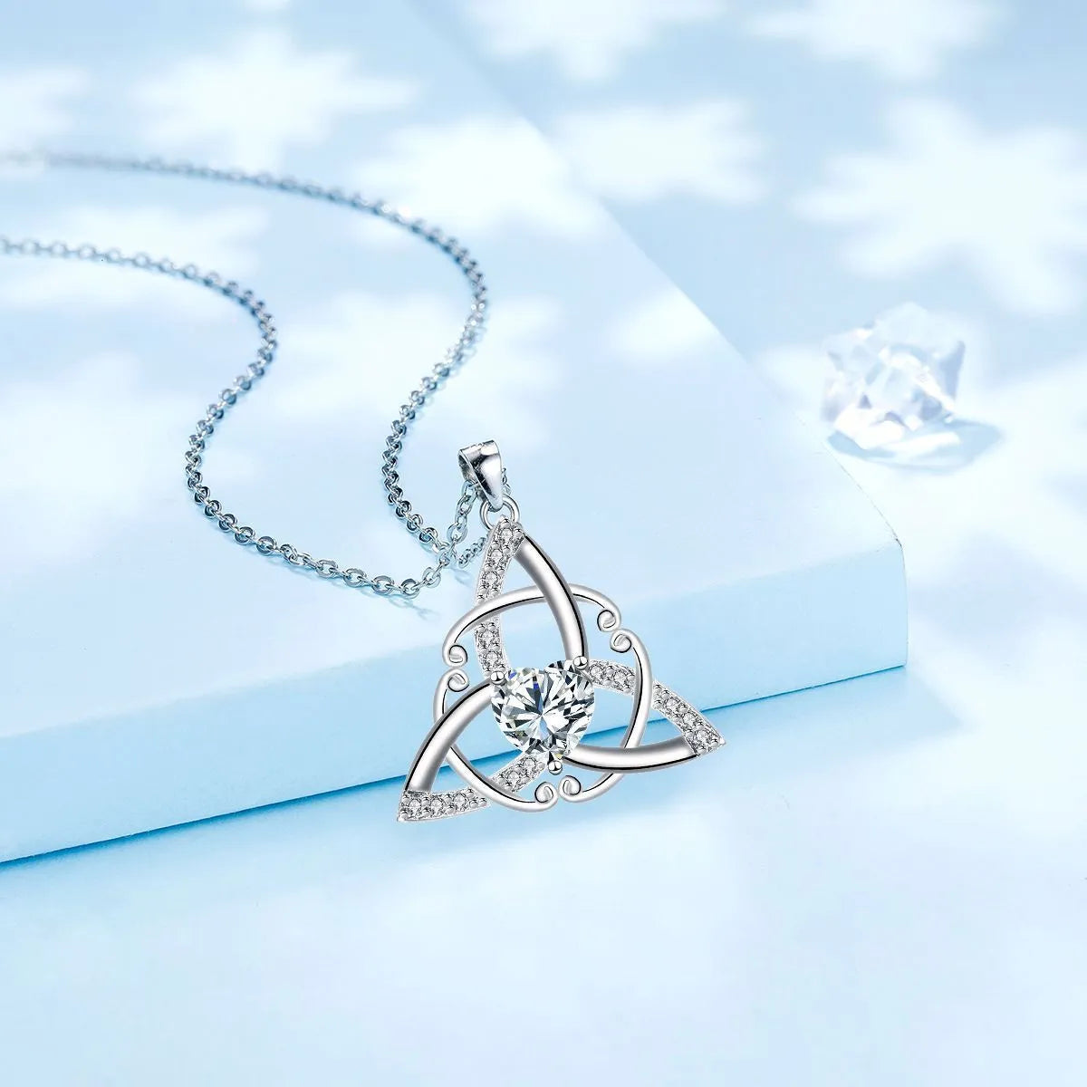 Copper Celtic knot necklace for women with geometric pendant in electroplated blue colour.