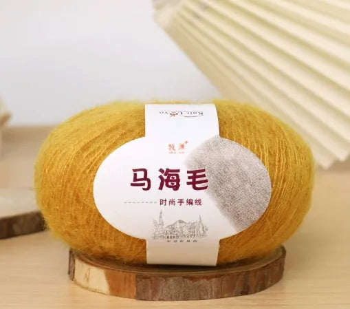 Single ball of mohair yarn in various colours for hand-woven DIY scarf knitting projects