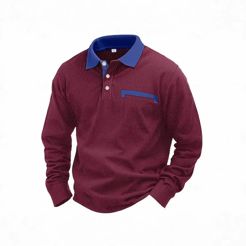 Man wearing a long-sleeved waffle texture polo shirt in a loose fit, showcasing the asymmetric detail.