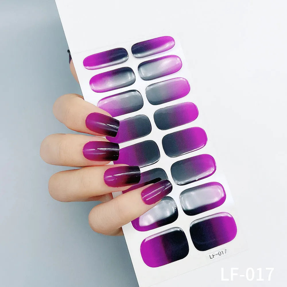 Sheet of 16 solid colour nail art sticker designs including cross, rose, and leopard print patterns.
