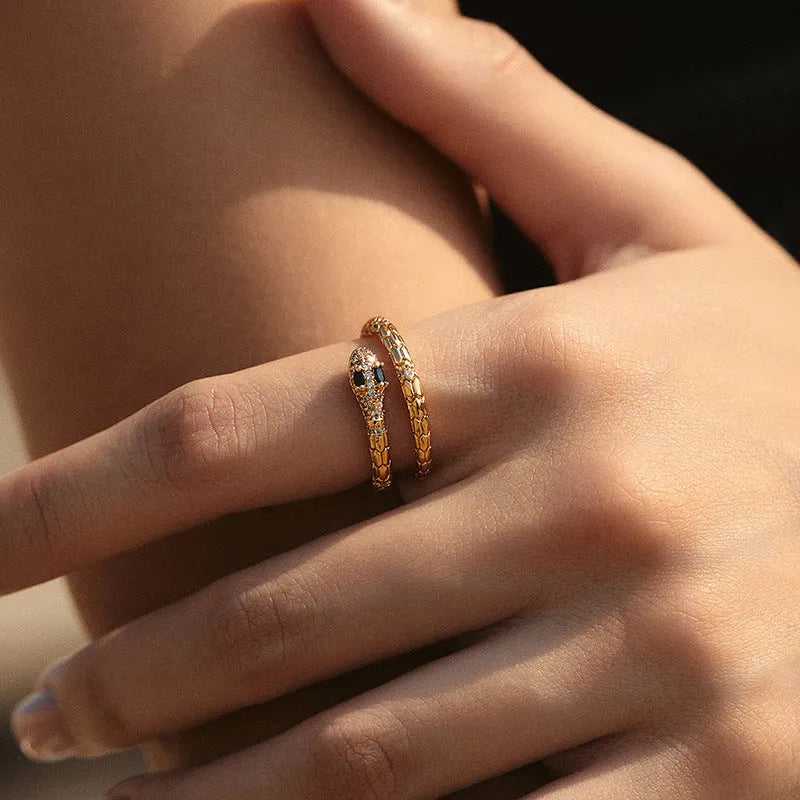 Adjustable snake-shaped copper ring with 18K gold colour plating on index finger