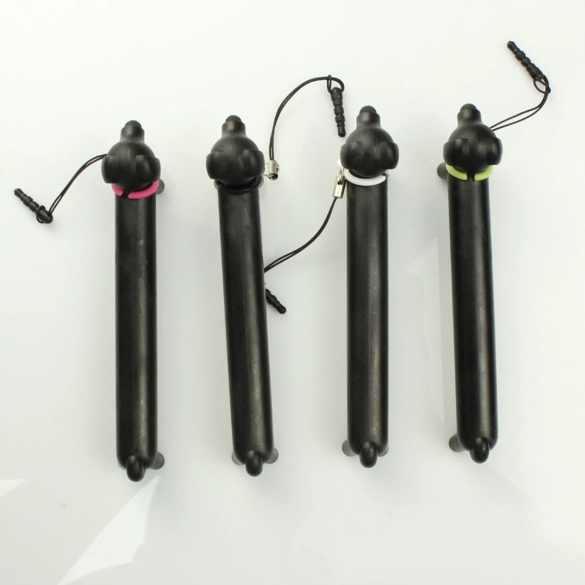 Black dog-shaped touch screen stylus pen showing adjustable length design and phone holder functionality