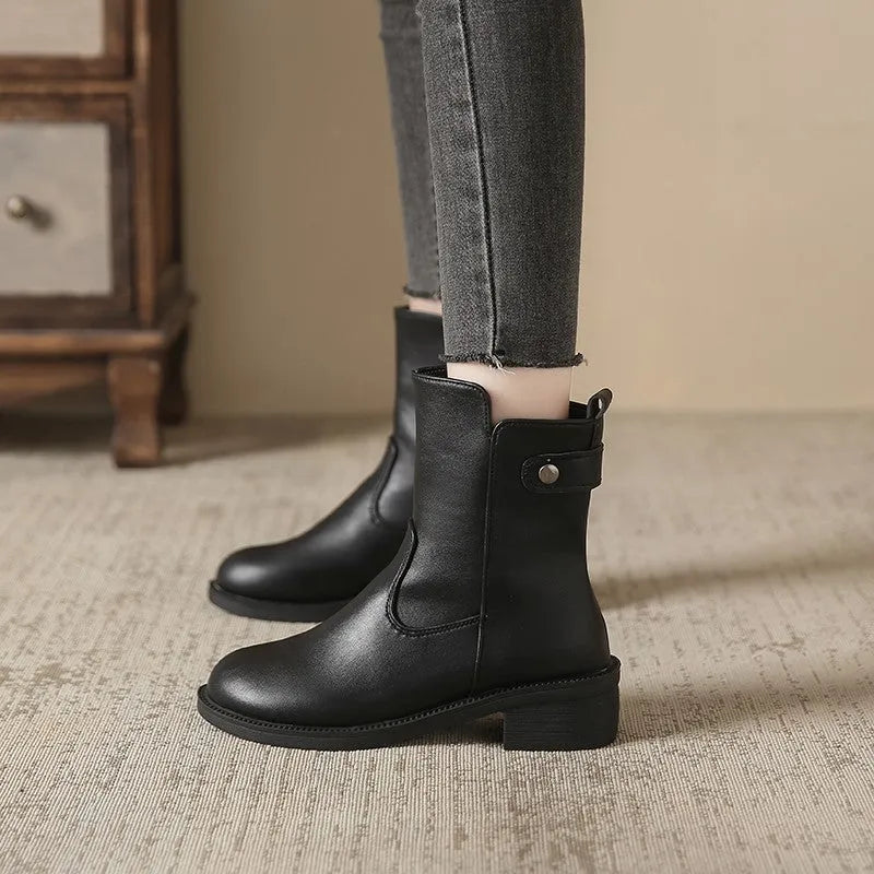 Black women's low heel side zip ankle boots with round toe on a white background.