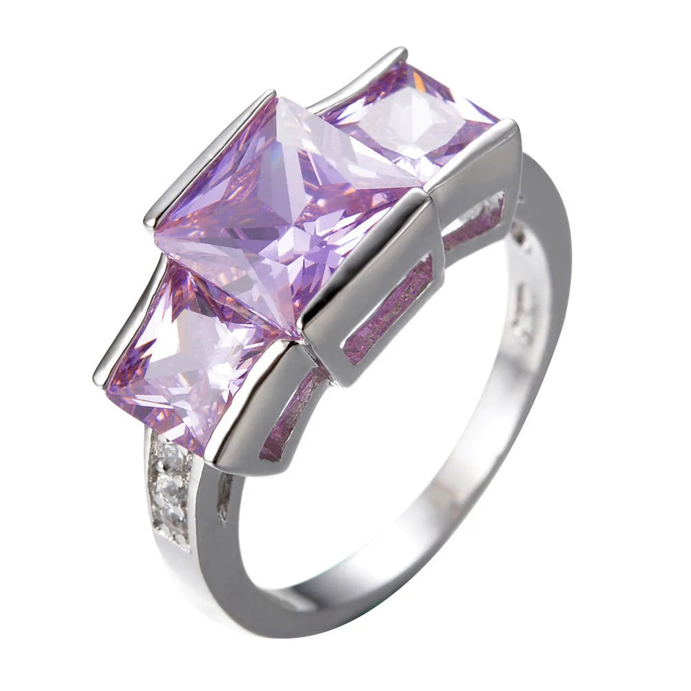 Women's geometric rainbow metal ring in electroplated copper showing colour options.