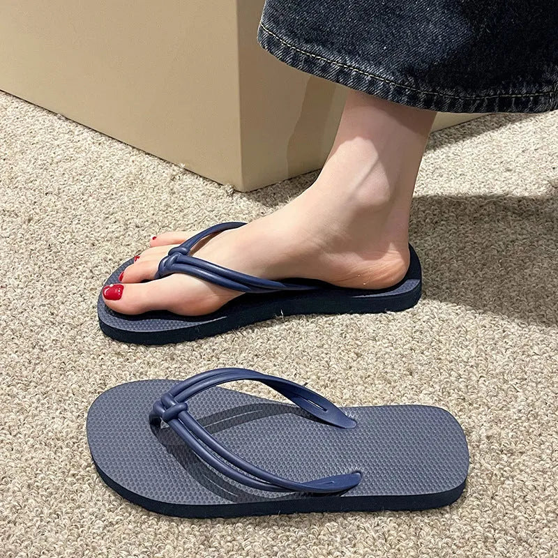 Men's PVC flip flops in a covered toe style on a light background, showing colour options.