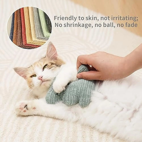 Cyan plush cat chew toy with rope ends, containing catnip and a bell.