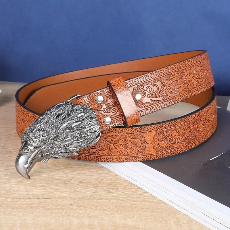 Men's brown belt with detailed cow head alloy buckle and imitation leather strap showing pin buckle closure