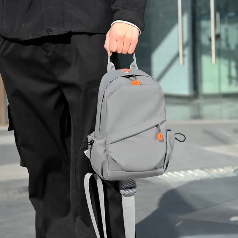 Men's black polyester crossbody bag showing single shoulder strap and simple design