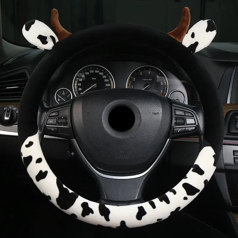Short plush car steering wheel cover in black, showing soft texture and fitted design.