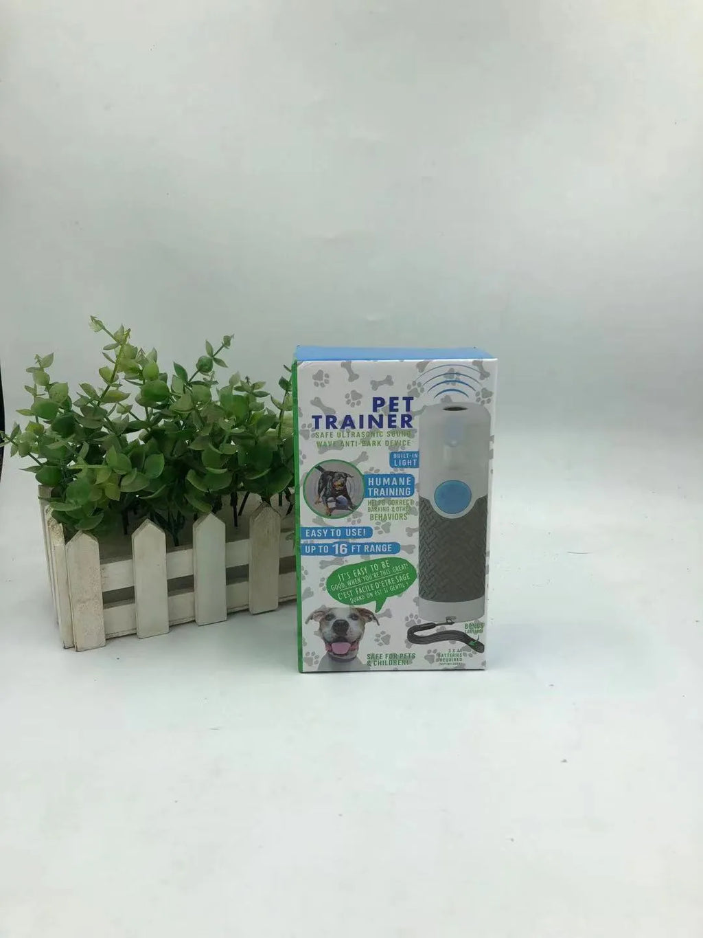 White handheld ultrasonic dog trainer for behaviour correction and bark control