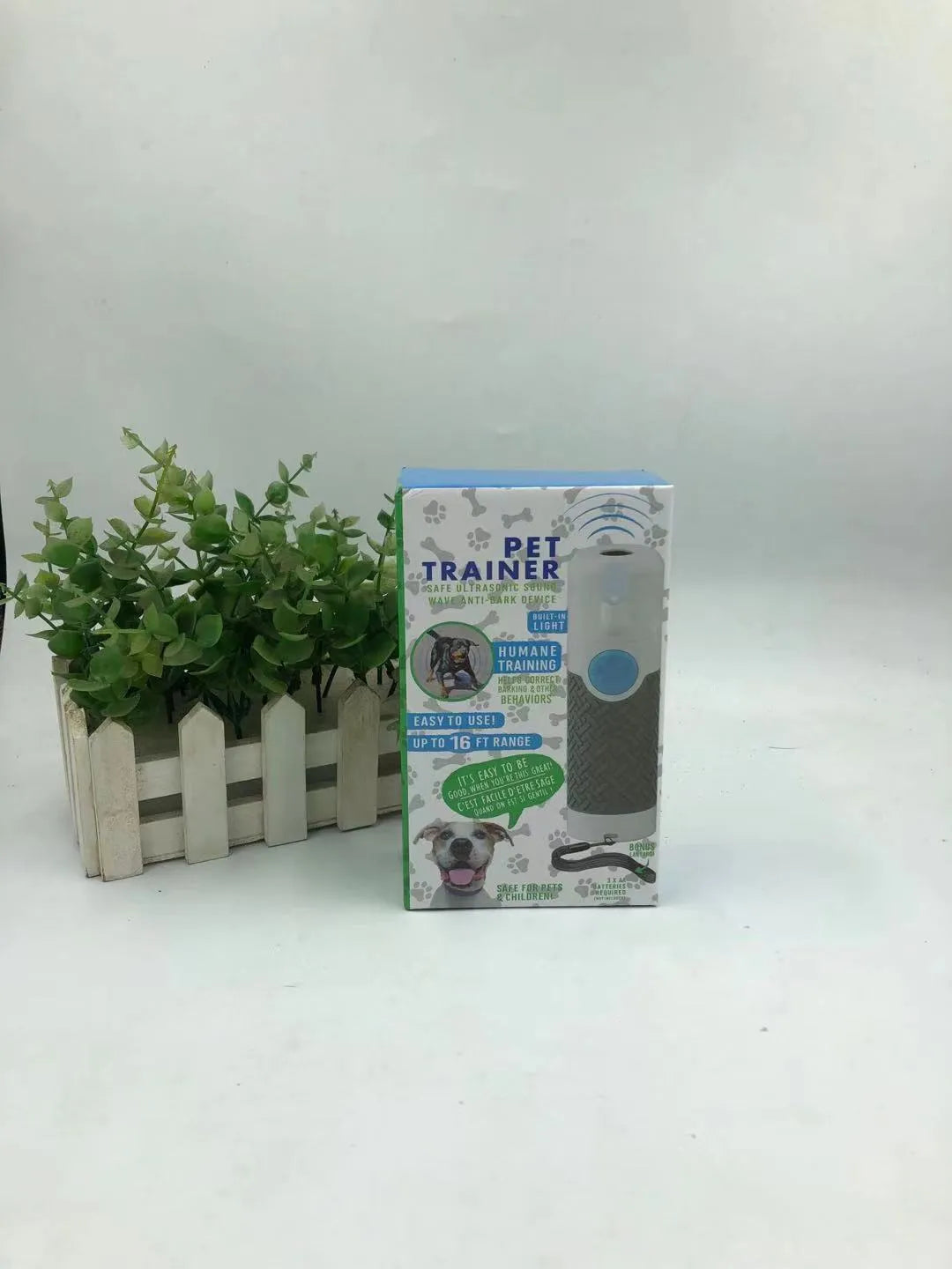 White handheld ultrasonic dog trainer for behaviour correction and bark control