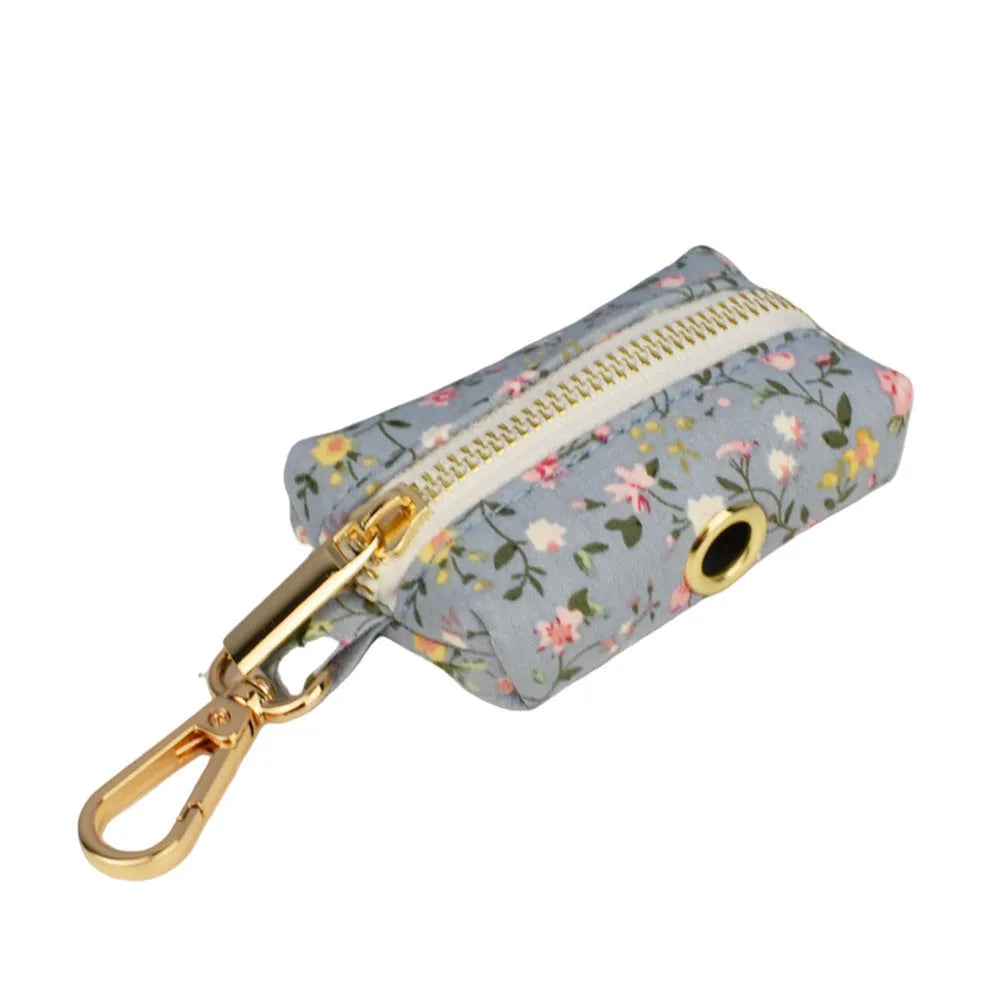 Blue floral polyester cotton dog collar and matching leash set with bow, vest, and poop bag accessories