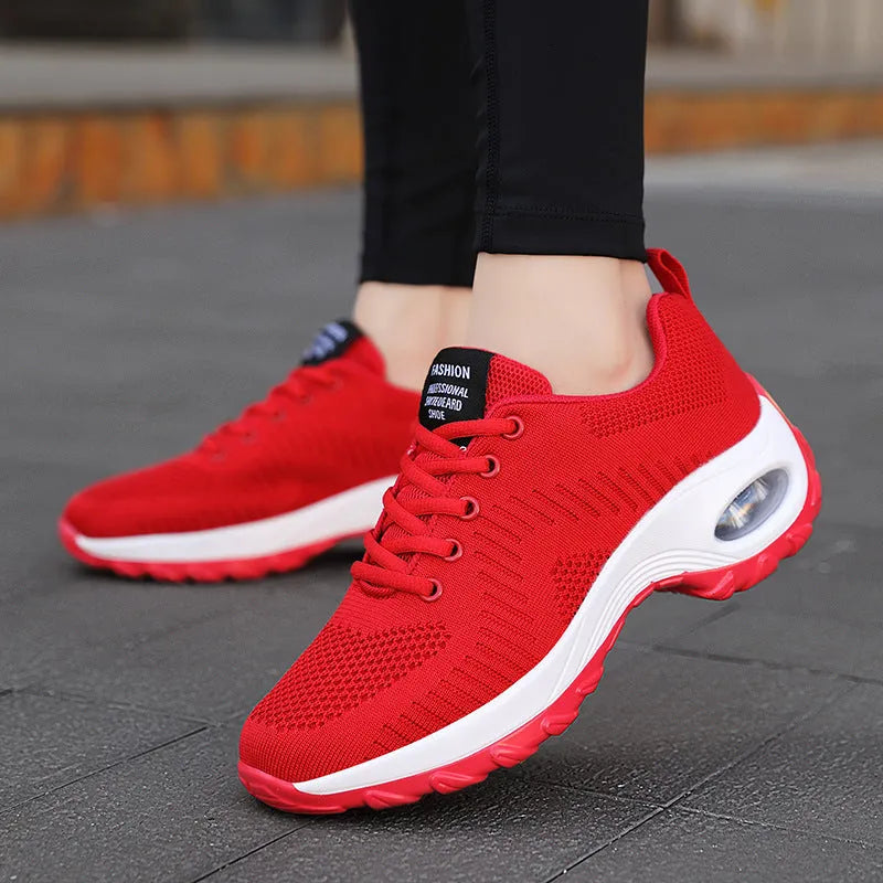 Women's red and black mesh low top sneakers with front lace-up and round toe design