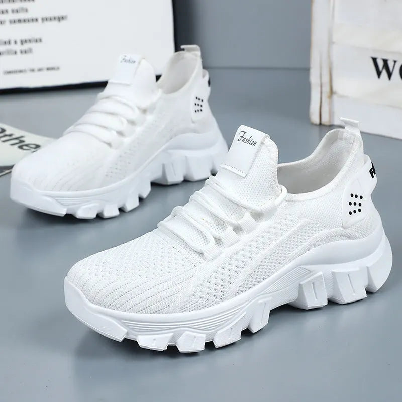 Women's breathable Flyknit sneaker with thick bottom PVC sole and round toe in white, pink, beige, or black.