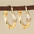 Geometric copper ear clips with ring design in golden colour for women