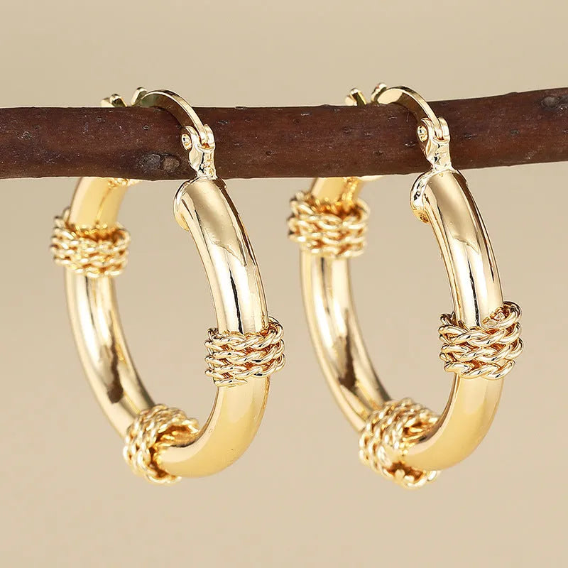 Geometric copper ear clips with ring design in golden colour for women