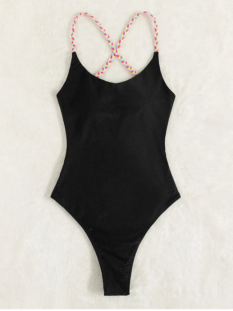 Black one-piece swimsuit for women with backless design and sleeveless cut on mannequin