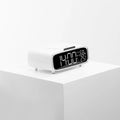 White Bluetooth speaker with integrated wireless charging pad and night light function