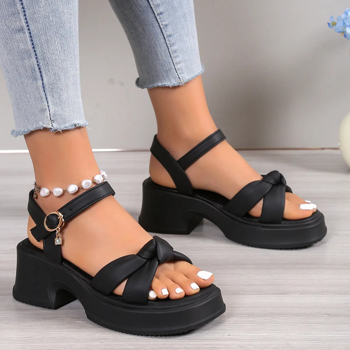 Black women's high heel slippers with thick rubber sole and button fastening