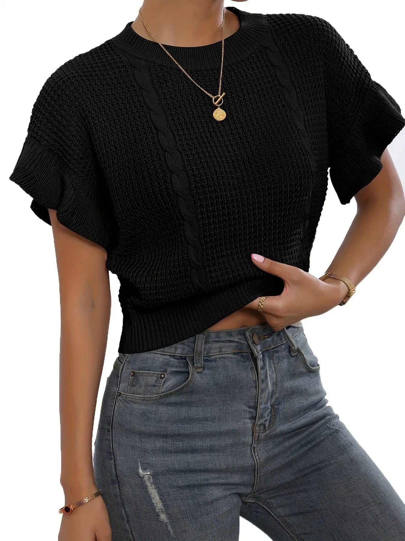 Loose white knitted pullover sweater with detailed twisted string ruffled short sleeves, round neck.