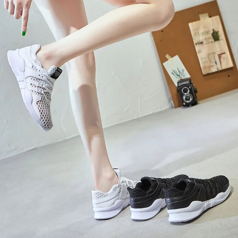 Low-top casual sneaker with a white mesh upper featuring a hollow breathable design and a flat EVA sole.