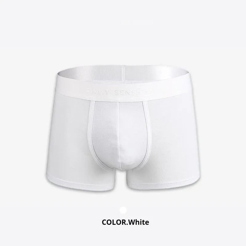 Men's solid colour cotton boxers in black, white, silver grey, and light green laid flat
