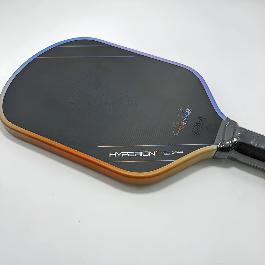 Carbon fibre pickleball racket with multi-colour matte pattern, showing 418mm length and honeycomb core construction.