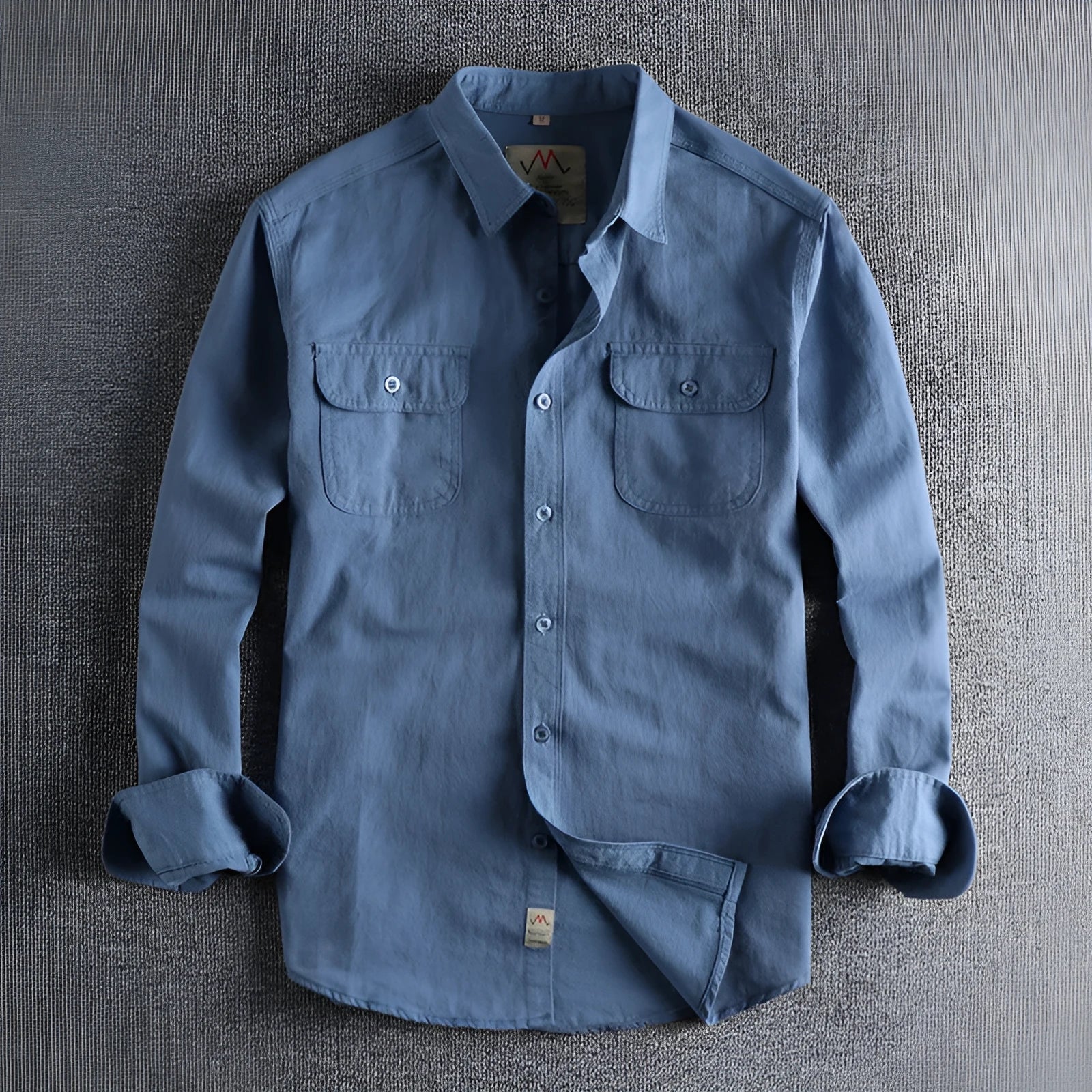 Men's solid colour cotton long sleeve shirt in a cardigan style on a hanger.